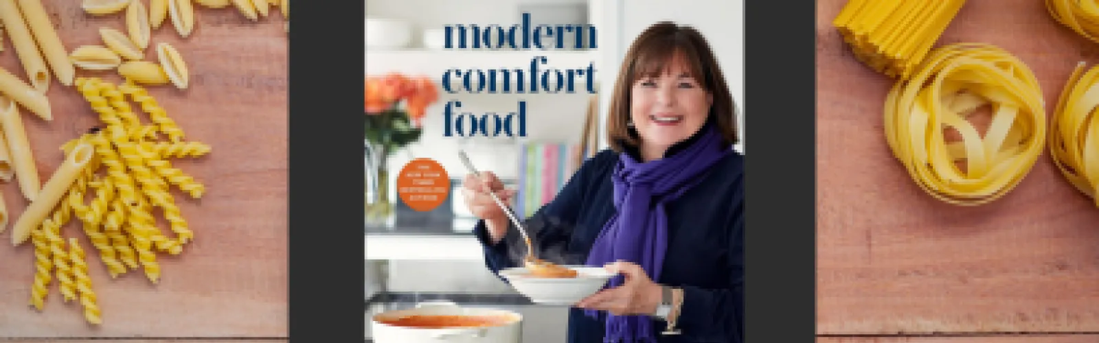 Cookbook which reads, "Modern Comfort Food," surrounded by pasta.