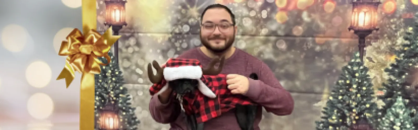 Tom and Toshi wearing a Christmas hat.