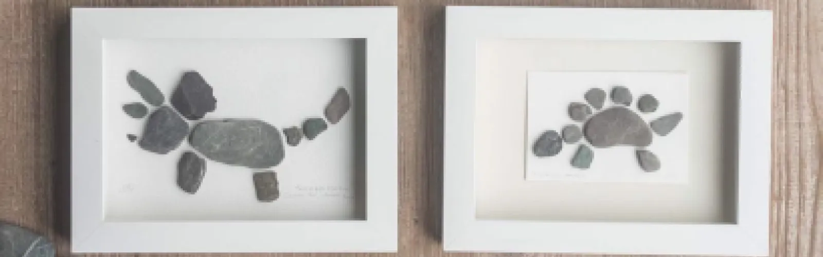 two pebble art creations, one in the shape of a triceritops, and one in the shape of a stegosaurus.