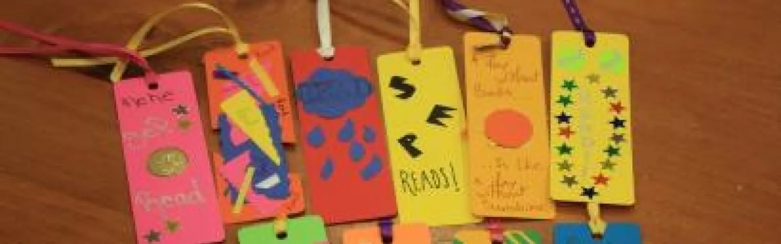 Bookmarks made using various media like markers and stickers.